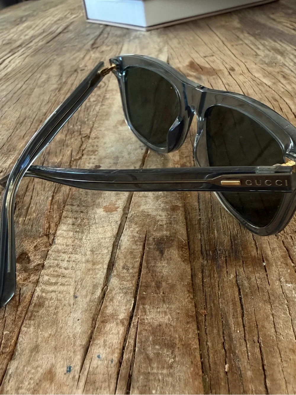 Gucci Transparent Gray Sunglasses with Dark Green Lenses